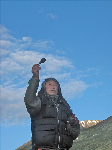 Danil Mamyev makes an offering before heading out onto the Ukok Plateau. © 2010 Christopher McLeod 