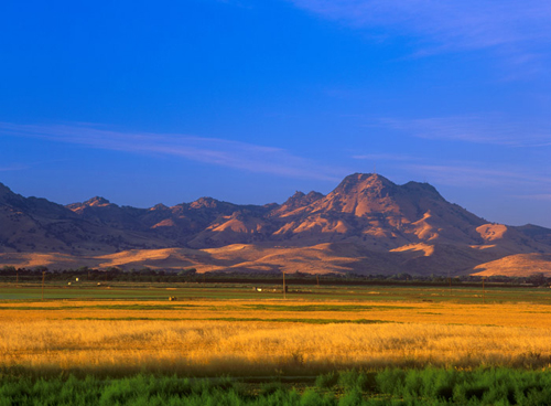 the late afternoon sun glows on South Butte in the Sutter Buttes. © 2005 <a href=